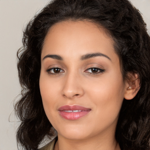 Joyful white young-adult female with long  brown hair and brown eyes