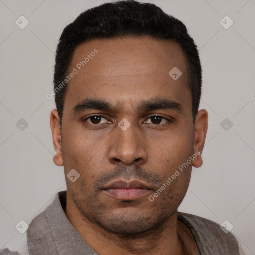 Neutral latino young-adult male with short  black hair and brown eyes