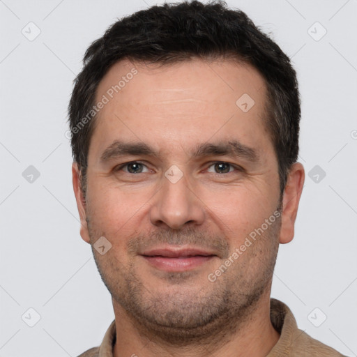 Joyful white adult male with short  brown hair and brown eyes