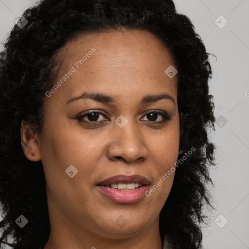 Joyful black young-adult female with long  brown hair and brown eyes