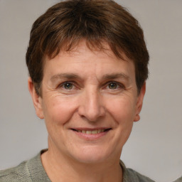 Joyful white adult male with short  brown hair and grey eyes