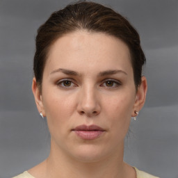 Neutral white young-adult female with short  brown hair and brown eyes