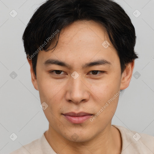 Joyful asian young-adult male with short  brown hair and brown eyes