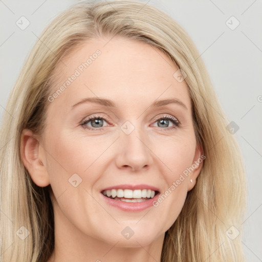 Joyful white young-adult female with long  brown hair and blue eyes