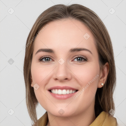 Joyful white young-adult female with medium  brown hair and grey eyes