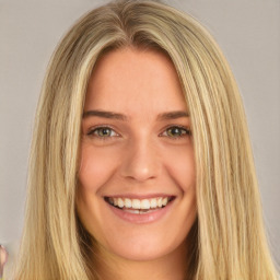 Joyful white young-adult female with long  brown hair and green eyes