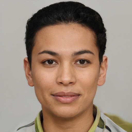 Joyful latino young-adult female with short  brown hair and brown eyes