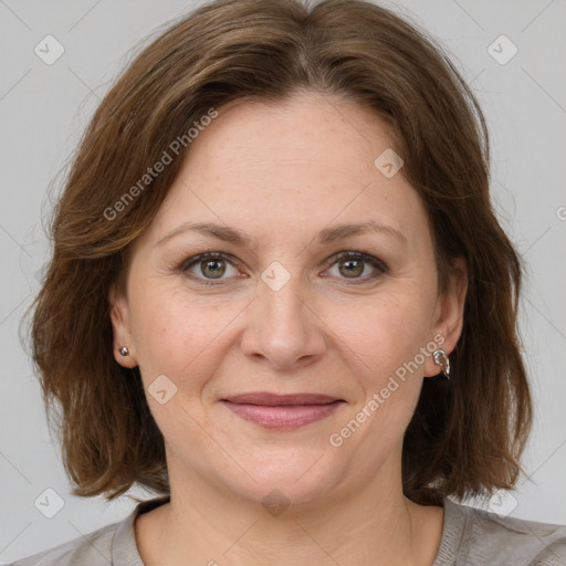 Joyful white adult female with medium  brown hair and grey eyes