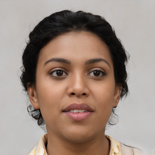 Joyful latino young-adult female with medium  black hair and brown eyes