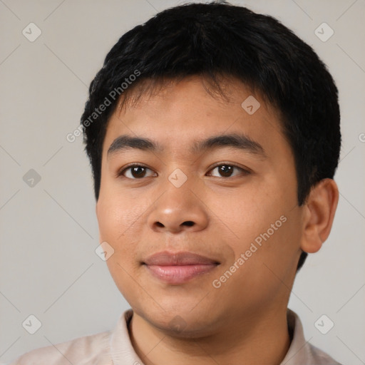 Joyful latino young-adult male with short  black hair and brown eyes