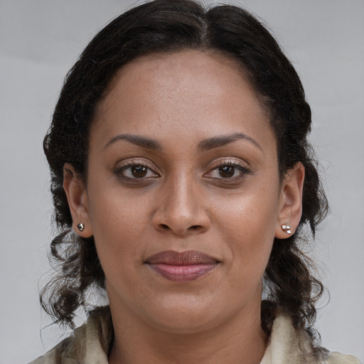 Joyful white young-adult female with long  brown hair and brown eyes