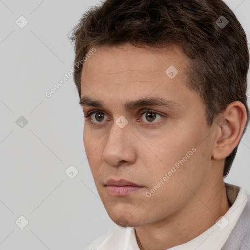 Neutral white young-adult male with short  brown hair and brown eyes