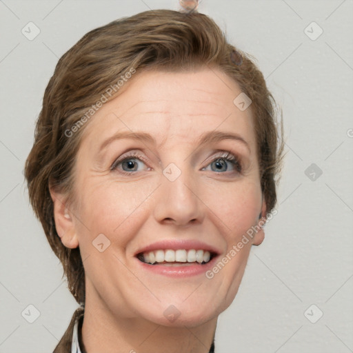 Joyful white adult female with short  brown hair and grey eyes