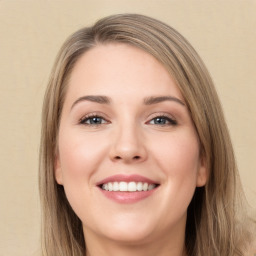 Joyful white young-adult female with long  brown hair and green eyes