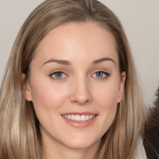 Joyful white young-adult female with long  brown hair and grey eyes