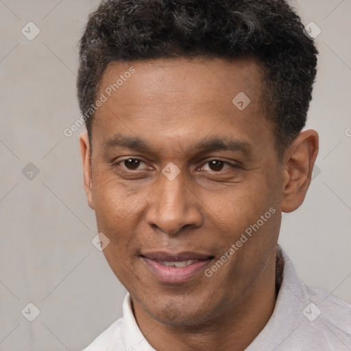 Joyful latino adult male with short  black hair and brown eyes