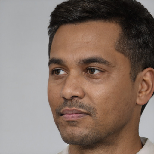 Neutral black young-adult male with short  black hair and brown eyes