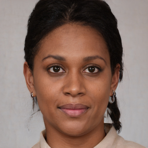 Joyful latino young-adult female with short  brown hair and brown eyes