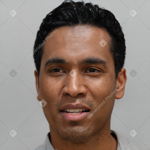 Joyful latino young-adult male with short  black hair and brown eyes