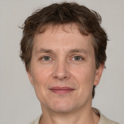 Joyful white adult male with short  brown hair and grey eyes