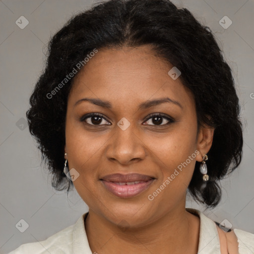 Joyful black adult female with medium  brown hair and brown eyes