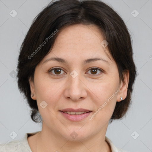 Joyful white adult female with medium  brown hair and brown eyes