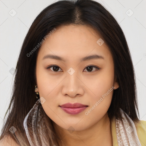 Joyful asian young-adult female with long  brown hair and brown eyes