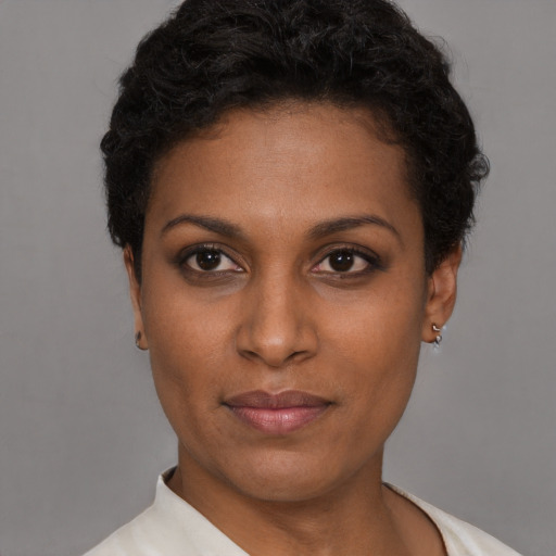 Neutral black young-adult female with short  brown hair and brown eyes