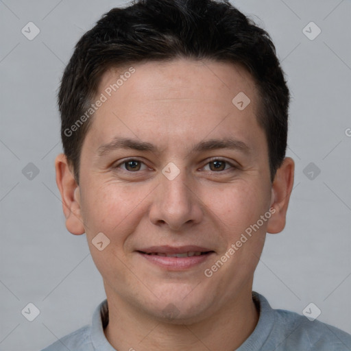 Joyful white young-adult male with short  brown hair and brown eyes