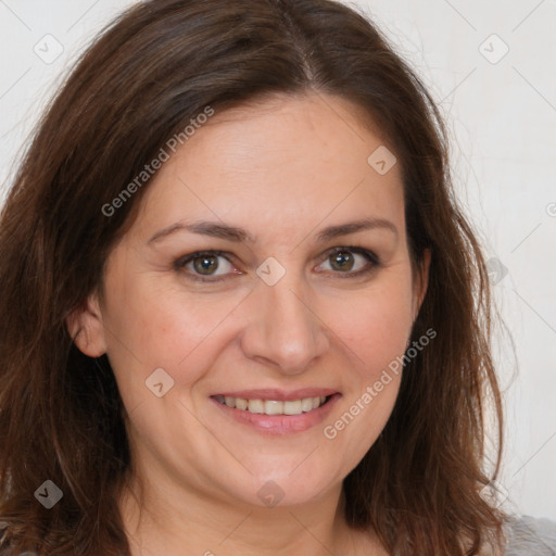 Joyful white adult female with long  brown hair and brown eyes