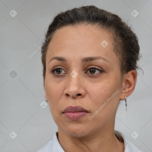 Joyful white adult female with short  brown hair and brown eyes