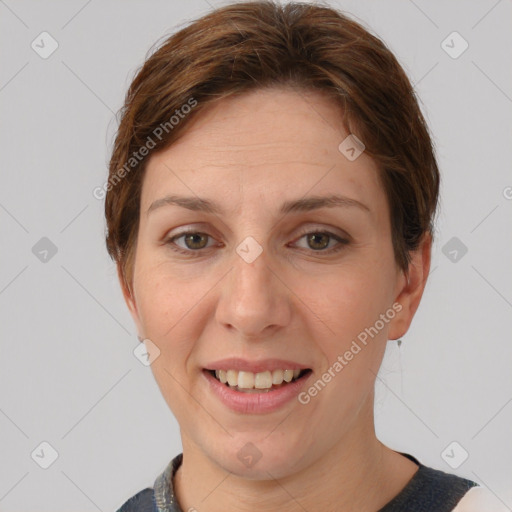 Joyful white adult female with short  brown hair and grey eyes