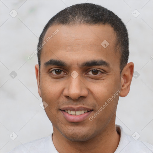 Joyful latino young-adult male with short  black hair and brown eyes