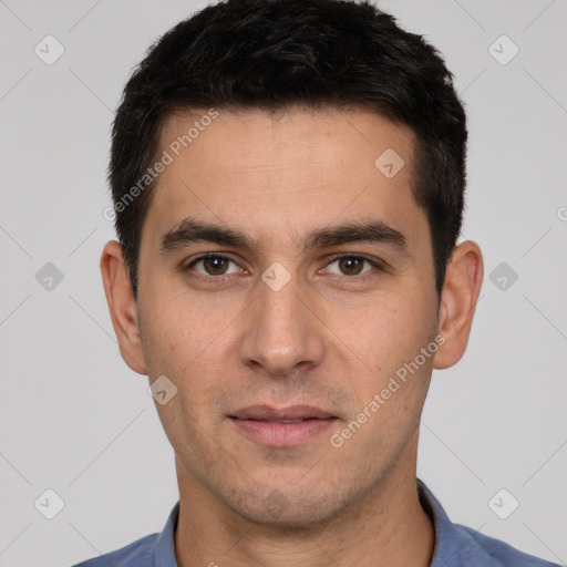 Joyful white young-adult male with short  black hair and brown eyes