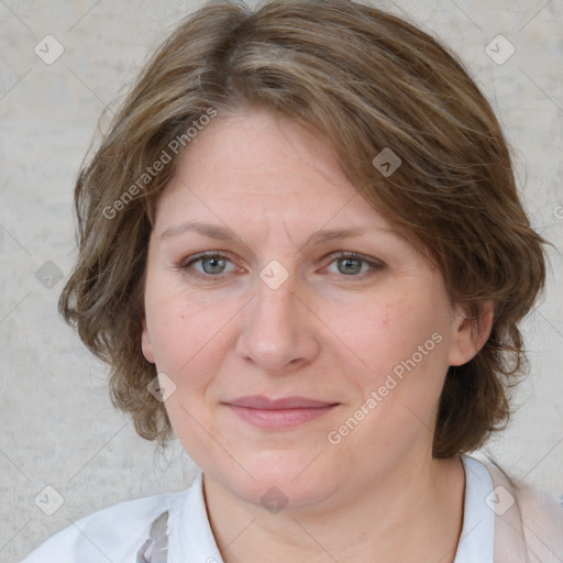 Joyful white adult female with medium  brown hair and blue eyes