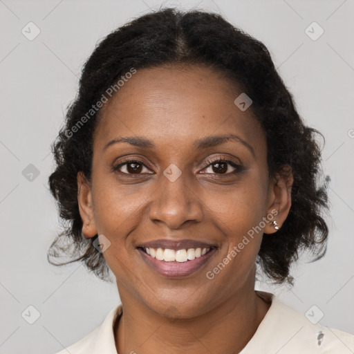 Joyful black young-adult female with medium  brown hair and brown eyes