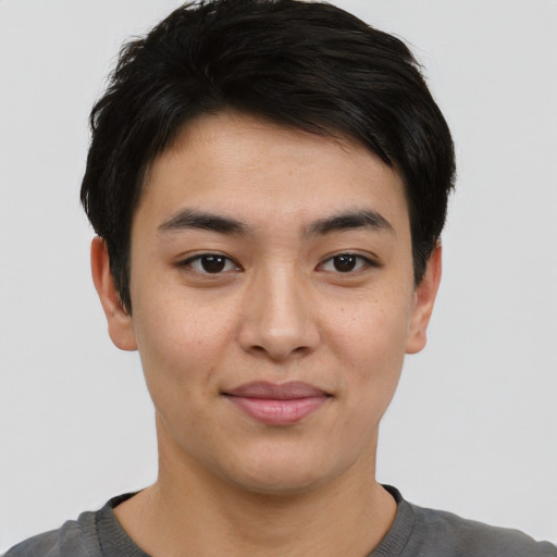 Joyful asian young-adult male with short  brown hair and brown eyes