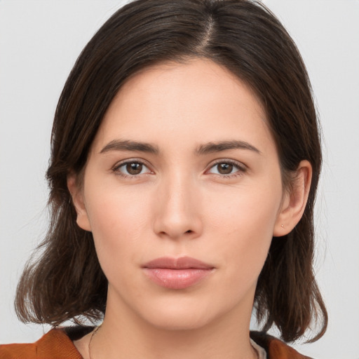 Neutral white young-adult female with medium  brown hair and brown eyes