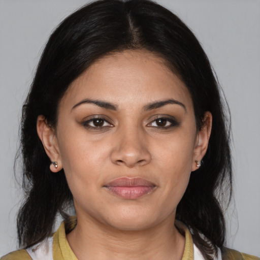 Joyful latino young-adult female with medium  black hair and brown eyes