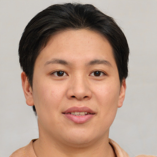 Joyful asian young-adult female with short  brown hair and brown eyes