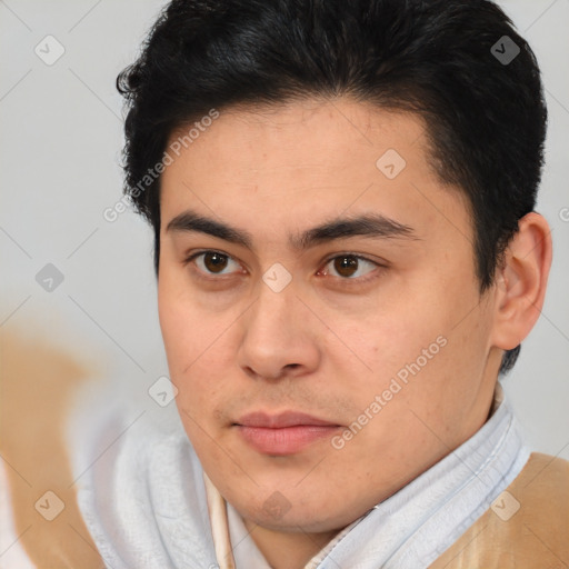 Joyful latino young-adult male with short  brown hair and brown eyes