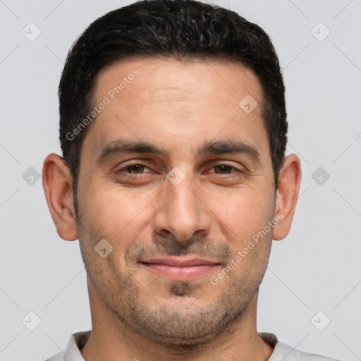 Joyful white adult male with short  brown hair and brown eyes