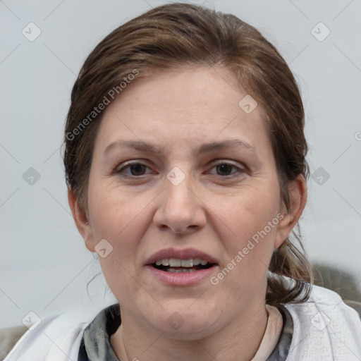 Joyful white adult female with medium  brown hair and grey eyes