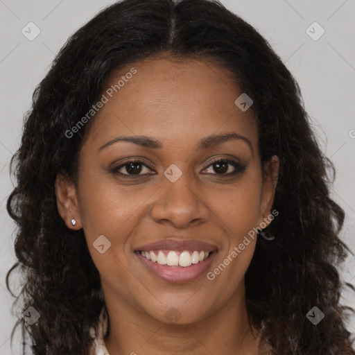 Joyful black young-adult female with long  brown hair and brown eyes