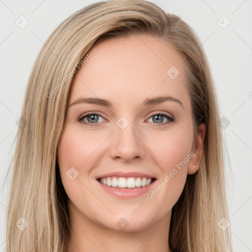 Joyful white young-adult female with long  brown hair and blue eyes