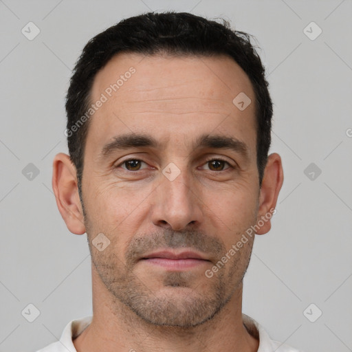 Joyful white adult male with short  brown hair and brown eyes