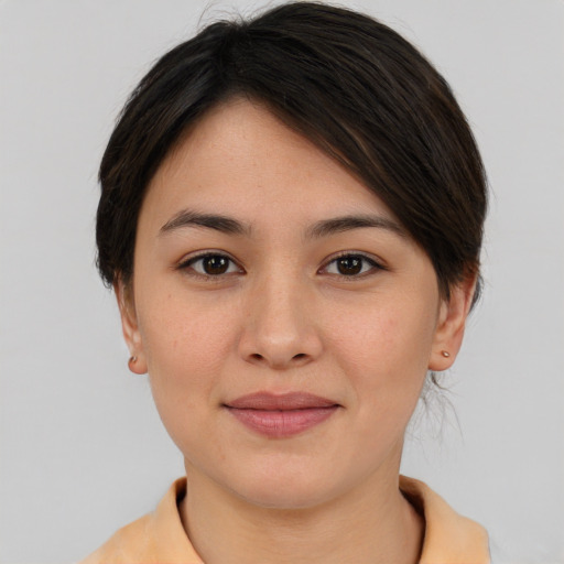 Joyful asian young-adult female with medium  brown hair and brown eyes