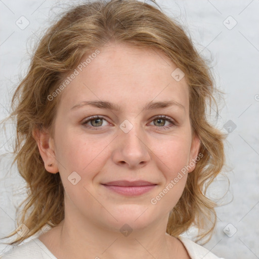 Joyful white young-adult female with medium  brown hair and blue eyes