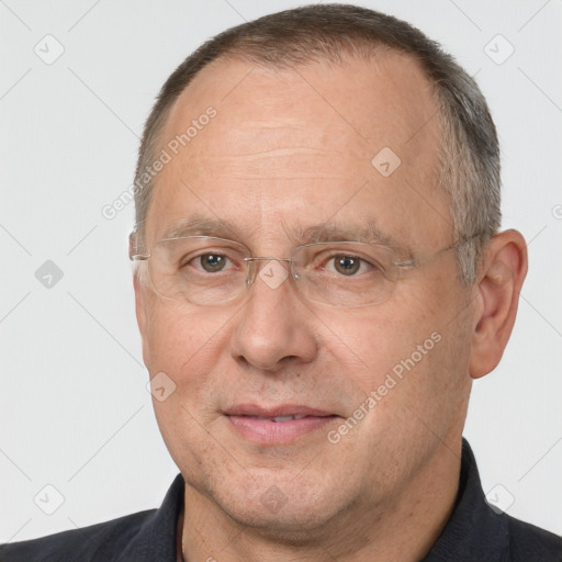 Joyful white middle-aged male with short  brown hair and brown eyes