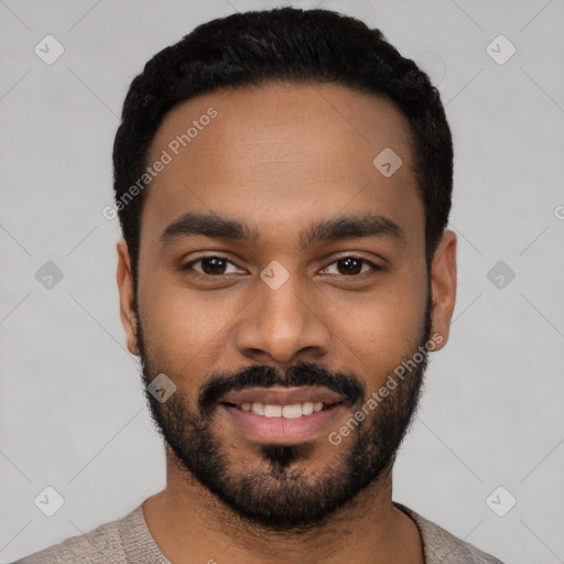 Joyful black young-adult male with short  black hair and brown eyes